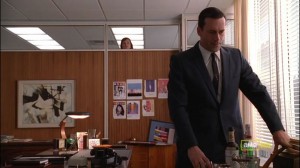 Peggy peeks in on Don as he suffers the loss of his secretary.